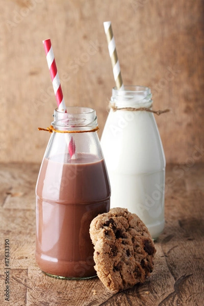 Fototapeta Fresh milk with drinking straw and cookies