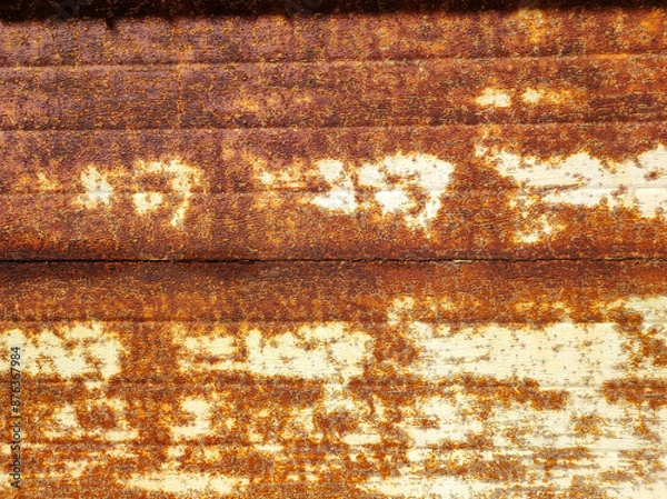 Fototapeta A close-up of an old rusty abandoned garage gate. Industry style, textured wallpaper. Backdrop of grungy warehouse gate. Copy text space