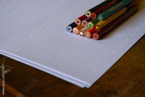 Fototapeta pencils on a notebook