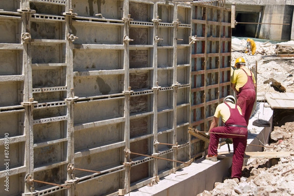 Obraz Working with prefabricated formwork on construction site