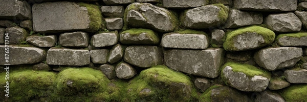 Fototapeta Rough Stone Wall with Weathered Texture and Moss