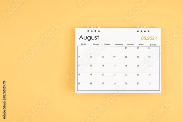 Fototapeta August 2024 desk calendar on yellow color background, position with copy space.