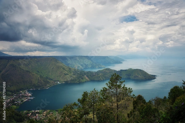 Obraz This panoramic photograph captures the breathtaking beauty of Lake Toba, located on the Sumatra in Indonesia. Image showcases the expansive lake.