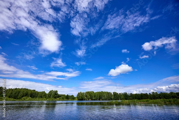 Fototapeta Beautiful summer river at sunny day with clouds reflection in the water