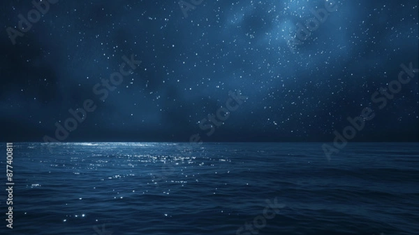 Fototapeta A dark blue ocean with a few stars in the sky