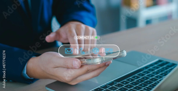 Fototapeta Contact us customer service concept. Man using smartphone contact call center service support phone, email, direct message, address. contact icons on virtual screen. Customer support hotline connect.