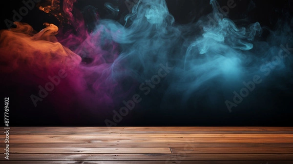 Fototapeta colorful smokes rises from a wooden floor against a black background