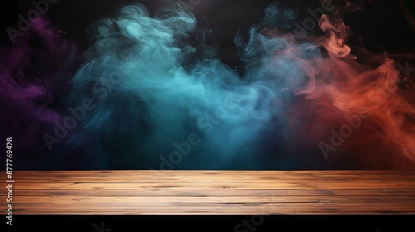 Fototapeta colorful smokes rises from a wooden floor against a black background