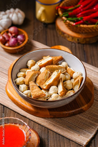 Fototapeta Pentol is a type of snack which can be found in Indonesia. it's a type of beef meatballs with flour, usually given with peanut sauce and sambal.