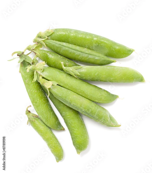 Fototapeta Several pods of green peas on a white background