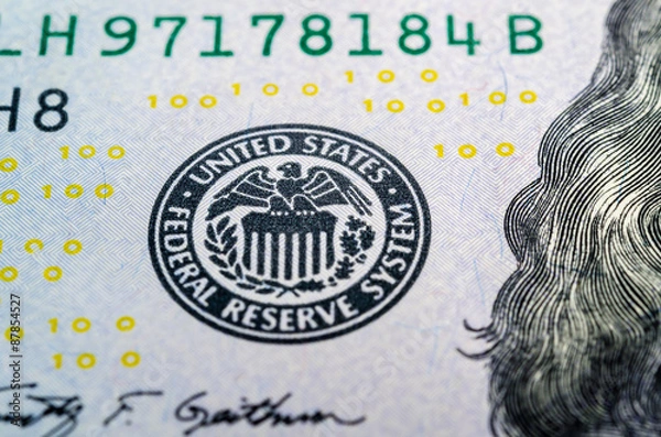 Fototapeta Federal reserve system symbol on hundred dollar bill closeup mac