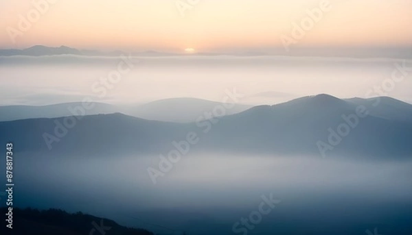 Fototapeta mountain layers and sunrise view in cold and foggy weather.