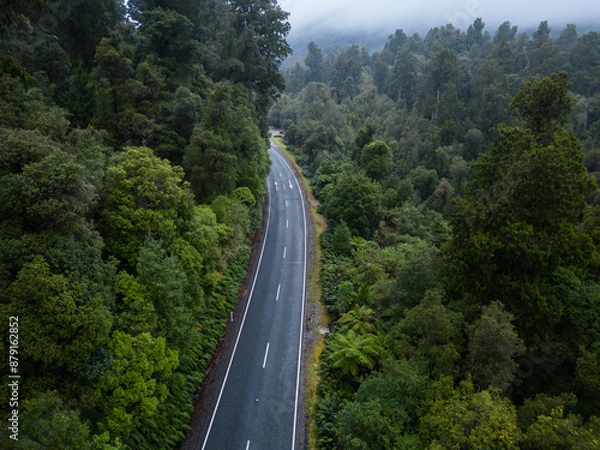 Fototapeta Haast Pass, New Zealand: Aerial drone view of the pass road between Wanaka and Haast in New Zealand south island West coast famous for its wild landscape on a rainy day.