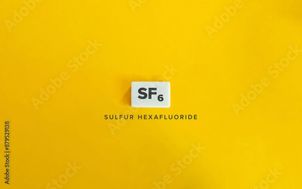 Fototapeta Sulfur Hexafluoride (SF₆). Greenhouse Gas (GHG). Text on Block Letter Tile on Yellow Background. Minimalist Aesthetics.