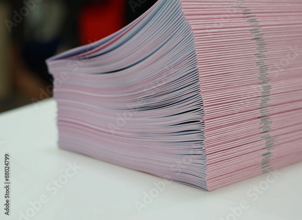 Fototapeta Piles of handout papers placed on table
