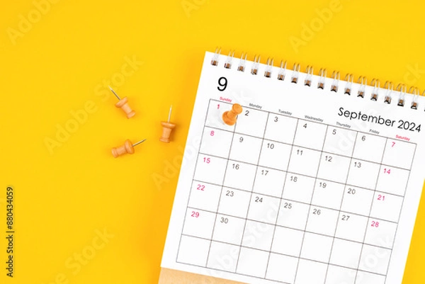 Obraz September 2024 Monthly desk calendar for 2024 year with wooden pin on yellow background.