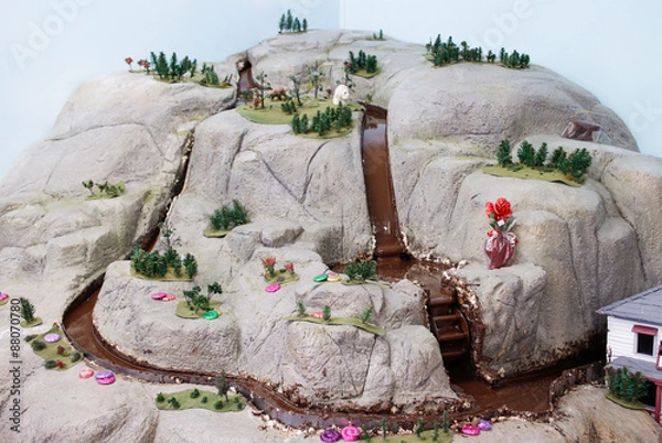 Fototapeta chocolate river streaming down mountain