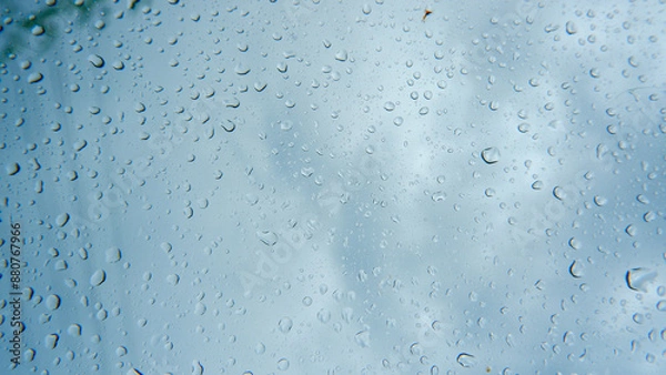Fototapeta Droplets Of Raindrops That Stick To A Car Window During Drizzling Rain