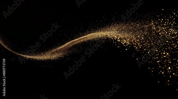 Fototapeta A stream of golden glitter appeared on the black background. The glitter fell in a way that looked like it was blown by the wind. The scene was quirky and fun.