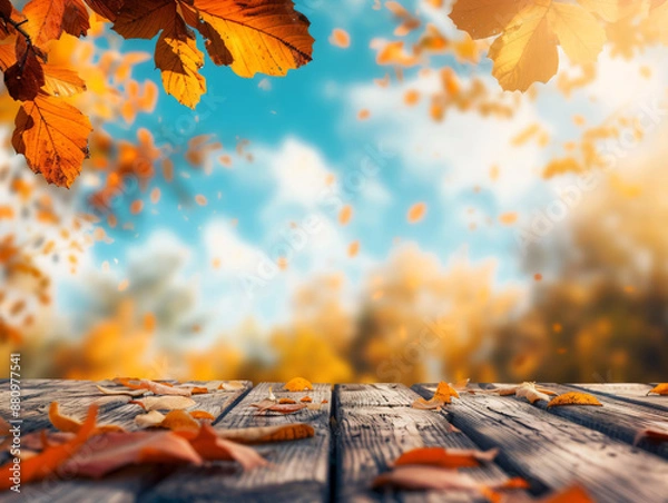 Fototapeta Beautiful autumn background with a wooden table and blurred orange leaves on a blue sky on a sunny day, in the style of product display montage template.