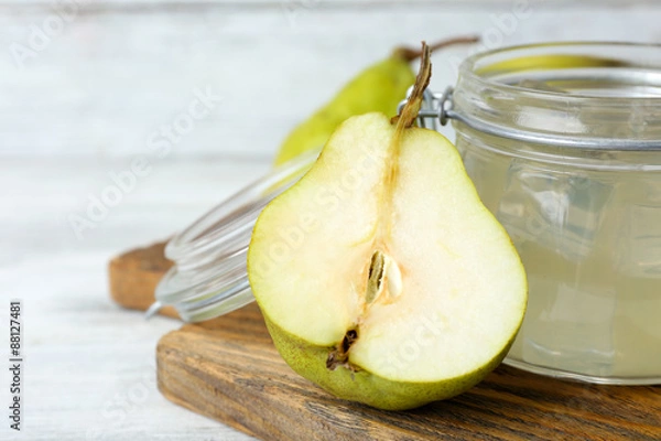Fototapeta Pear juice with fresh fruit and cinnamon on table close up