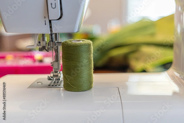 Obraz Electric sewing machine needle with spools of thread