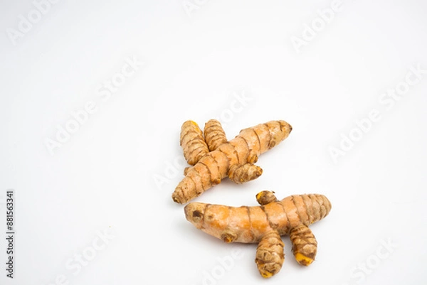 Fototapeta Turmeric is a typical Indonesian spice that is yellow in color. in Groups. typical Indonesian. isolated on white background.