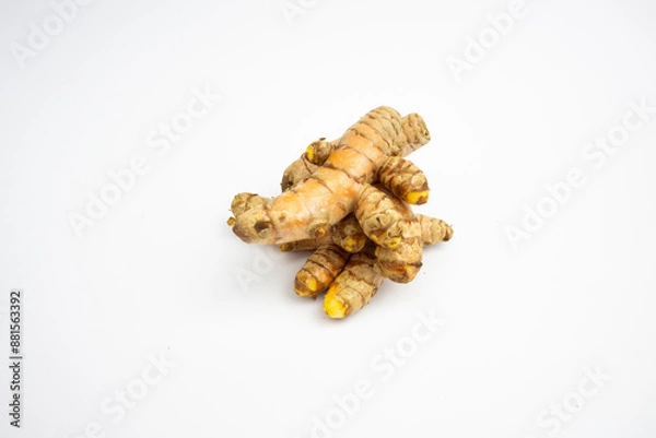 Fototapeta Turmeric is a typical Indonesian spice that is yellow in color. in Groups. typical Indonesian. isolated on white background.