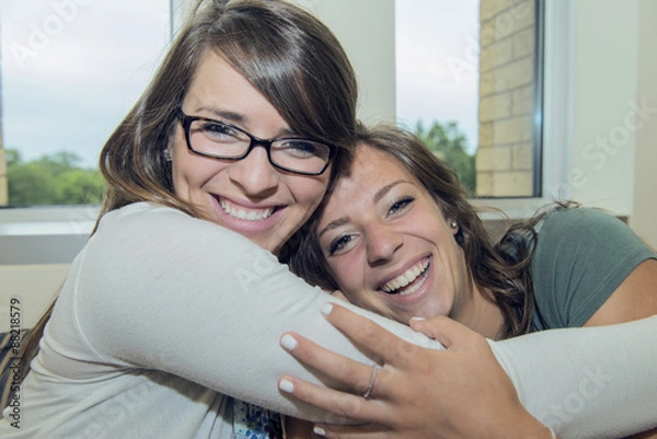 Obraz Two girls hug each other