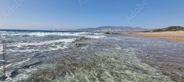 Fototapeta The crystal clear water of the Aegean sea on a beach in Rhodes, Greece