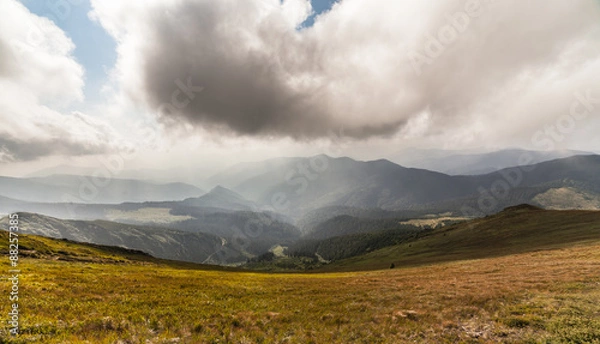 Fototapeta storm clouds over the mountains