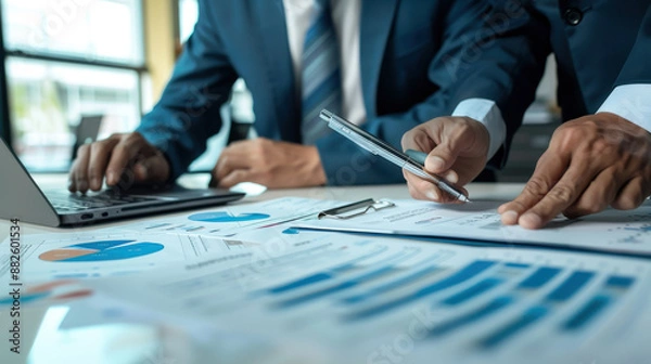 Fototapeta Consultants conducting a financial projection analysis, discussing future revenue streams and potential investments.