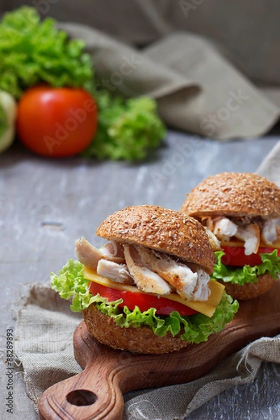Obraz Burger with chicken meat, cheese, tomato
