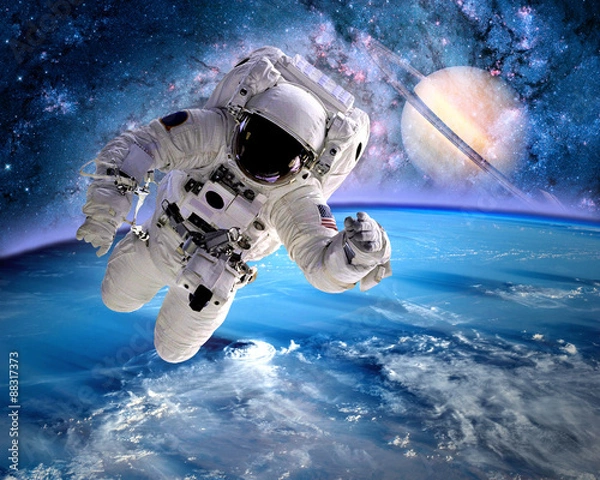 Fototapeta Astronaut spaceman outer space planet saturn earth universe. Elements of this image furnished by NASA.