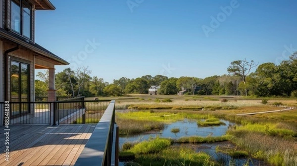Obraz The custom-built, elevated walkways in the backyard of a Suburban Cape Cod home, providing views over a restored native wetland area