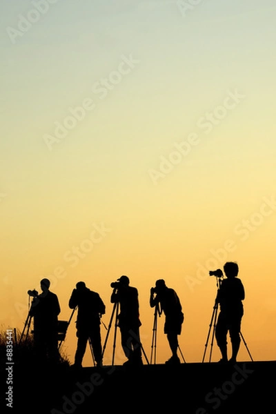 Fototapeta Silouette of five photographers lined up shooting photos