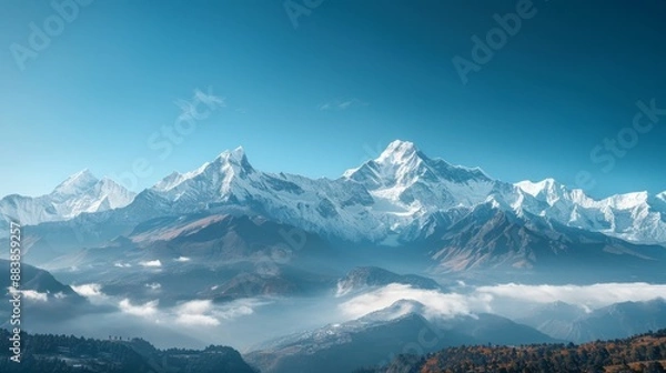 Obraz A panoramic view of a snow-capped mountain range under a clear blue sky