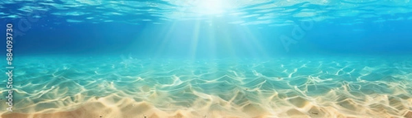 Fototapeta Breathtaking underwater view with sunlight penetrating the crystal clear water, showcasing the serene beauty of the ocean floor and its vibrant textures.