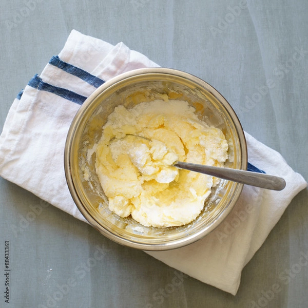 Obraz Softened butter being mixed with sugar and powdered sugar to make pate brisee