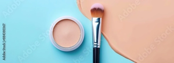 Fototapeta A cream moisturizer and brush on a different color background