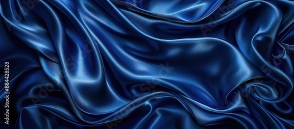 Fototapeta A background made of wavy strands of blue satin fabric