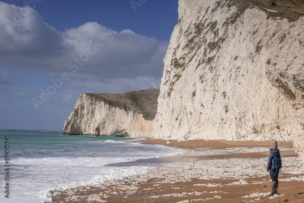 Fototapeta Person walking on the british beach, Jurassic Coast, Dorset, UK