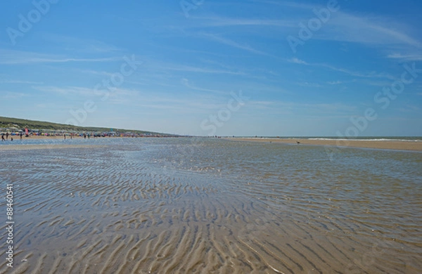 Fototapeta Blue cloudy sky over a beach in summer