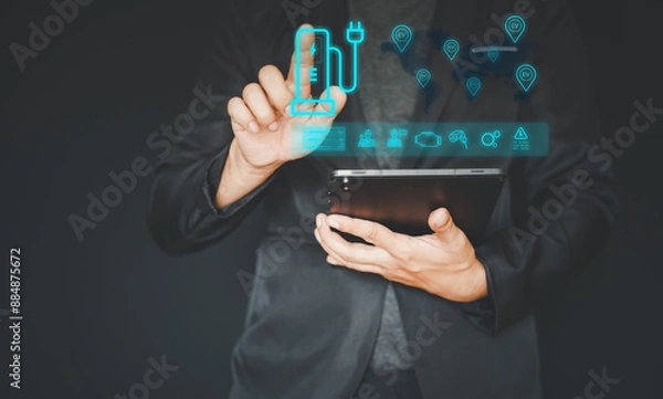 Fototapeta electric vehicle charging station for charging EV batteries. Plug for vehicle with electric engine.  EV charging station for electric vehicles in green energy and eco