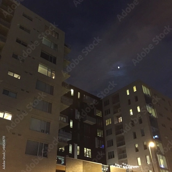 Fototapeta moon over downdown Denver luxury condos
