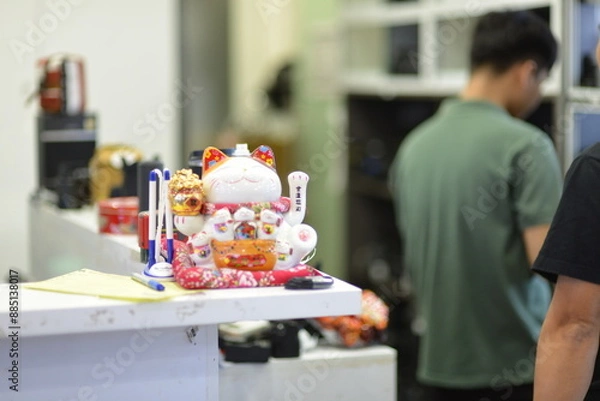 Obraz Lucky cat, a symbol of good fortune used to attract customers by small retail shops and family businesses, often worshipped and prayed to, according to Asian tradition and belief