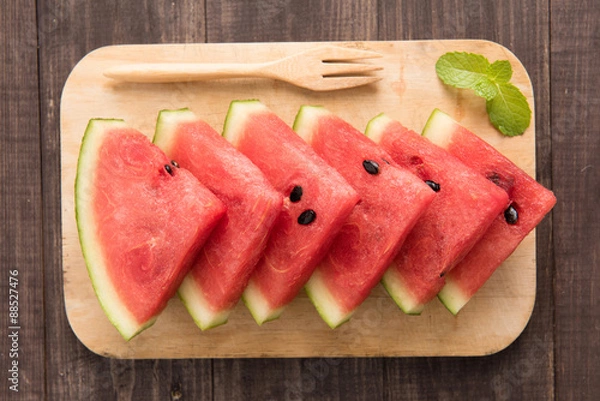 Obraz Fresh watermelon pieces placed on wooden background