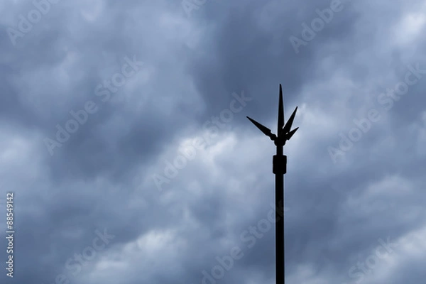 Obraz Silhouette Lightning Rod against Dark Clouds