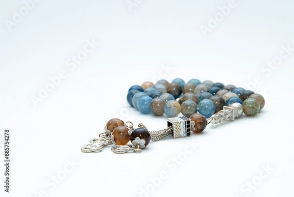 Fototapeta Rosary or prayer beads, isolated on white background	
