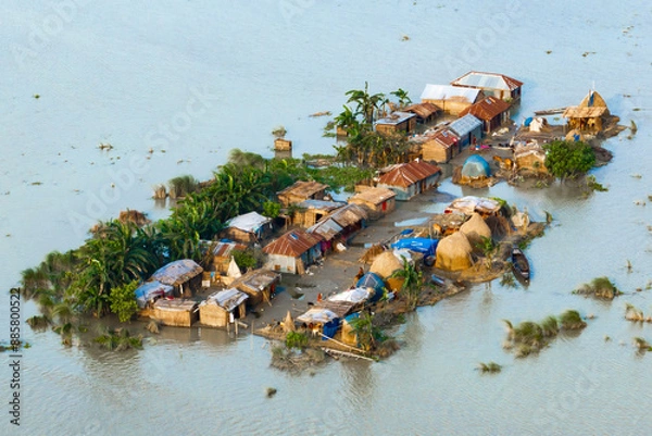 Obraz Aerial view showcasing the devastating impact of floods on villages in Northern Bangladesh, highlighting the submerged homes, affected communities, highlighting the severe impact and the resilience